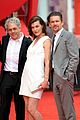 milla jovovich cradles baby bump at premiere 14