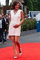 milla jovovich cradles baby bump at premiere 21